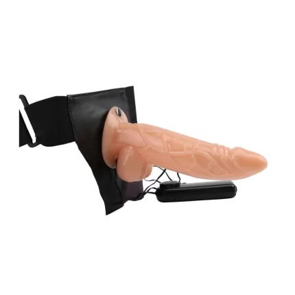 Dildo con vibración colocado en arnés strap-on de correas ajustables